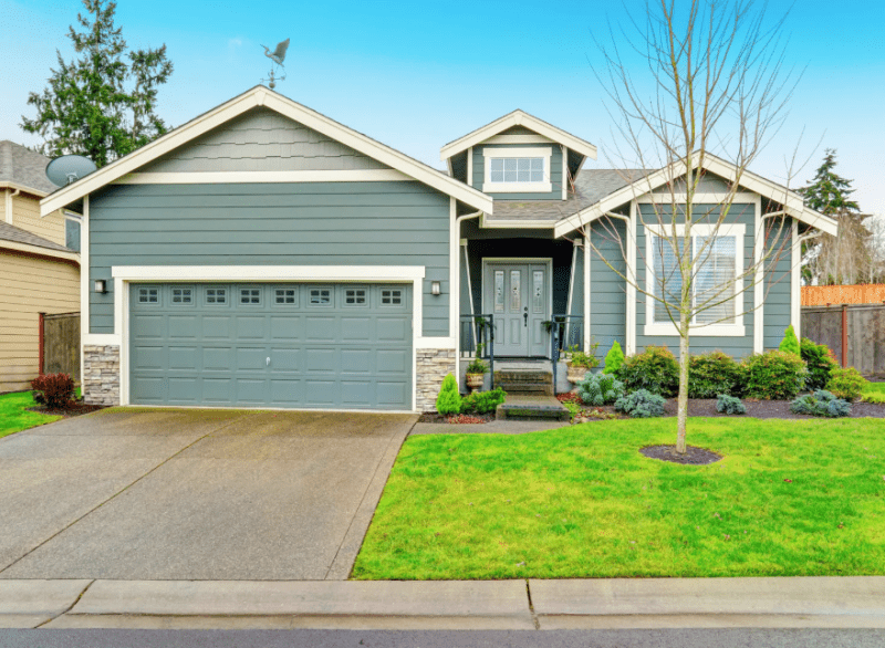 Image of house with driveway and curb