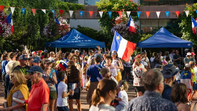 Crowd in front of Moncton City Hall for National Acadian Day