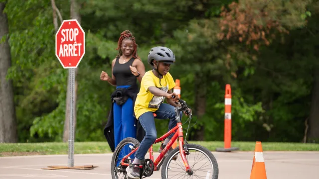 Kid riding bike at Centennial Park