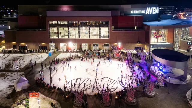 A bird's-eye view of the Ian Fowler Oval full of skaters at a Glow Skate event. 