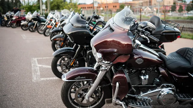 A row of motorcycles parked along a city street