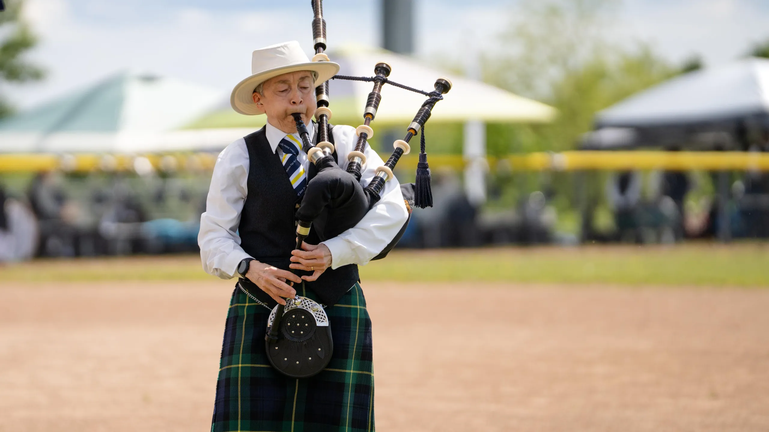 Man playing the bagpipes at the Highland Games