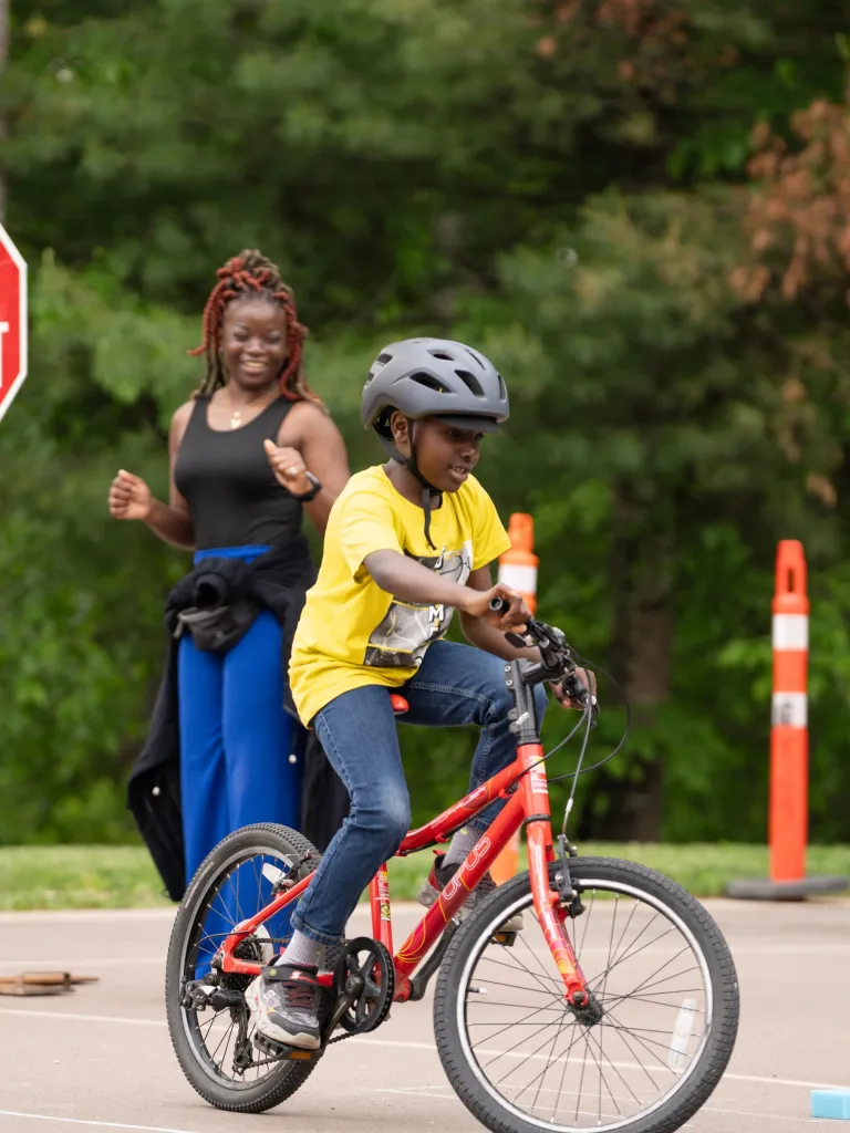 Kid riding bike at Centennial Park