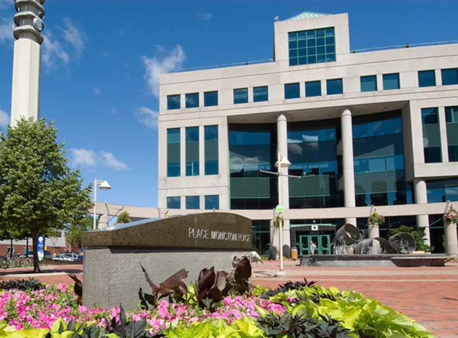 City Hall with Moncton Place sign summer