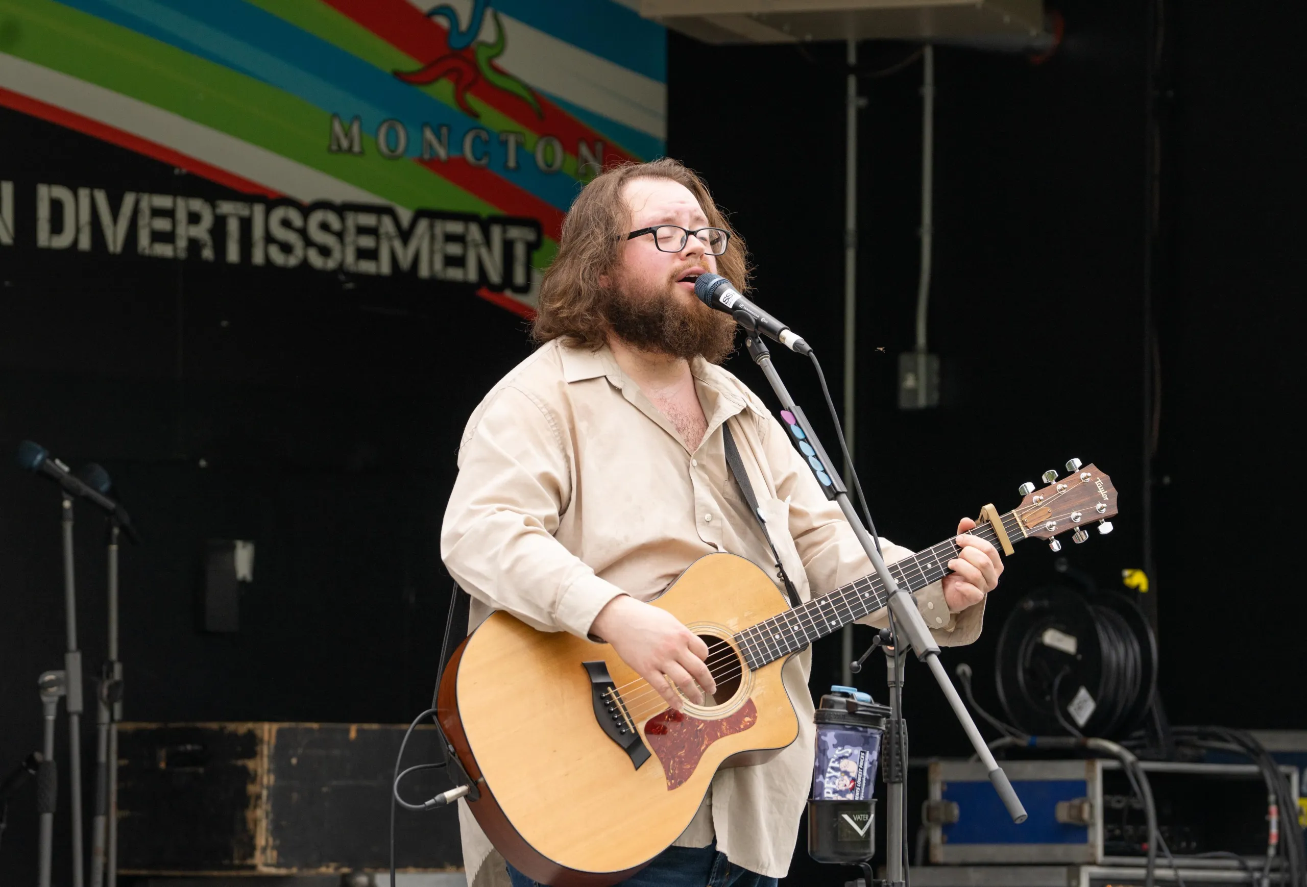 Artist singing at EnviroFest at Centennial Park