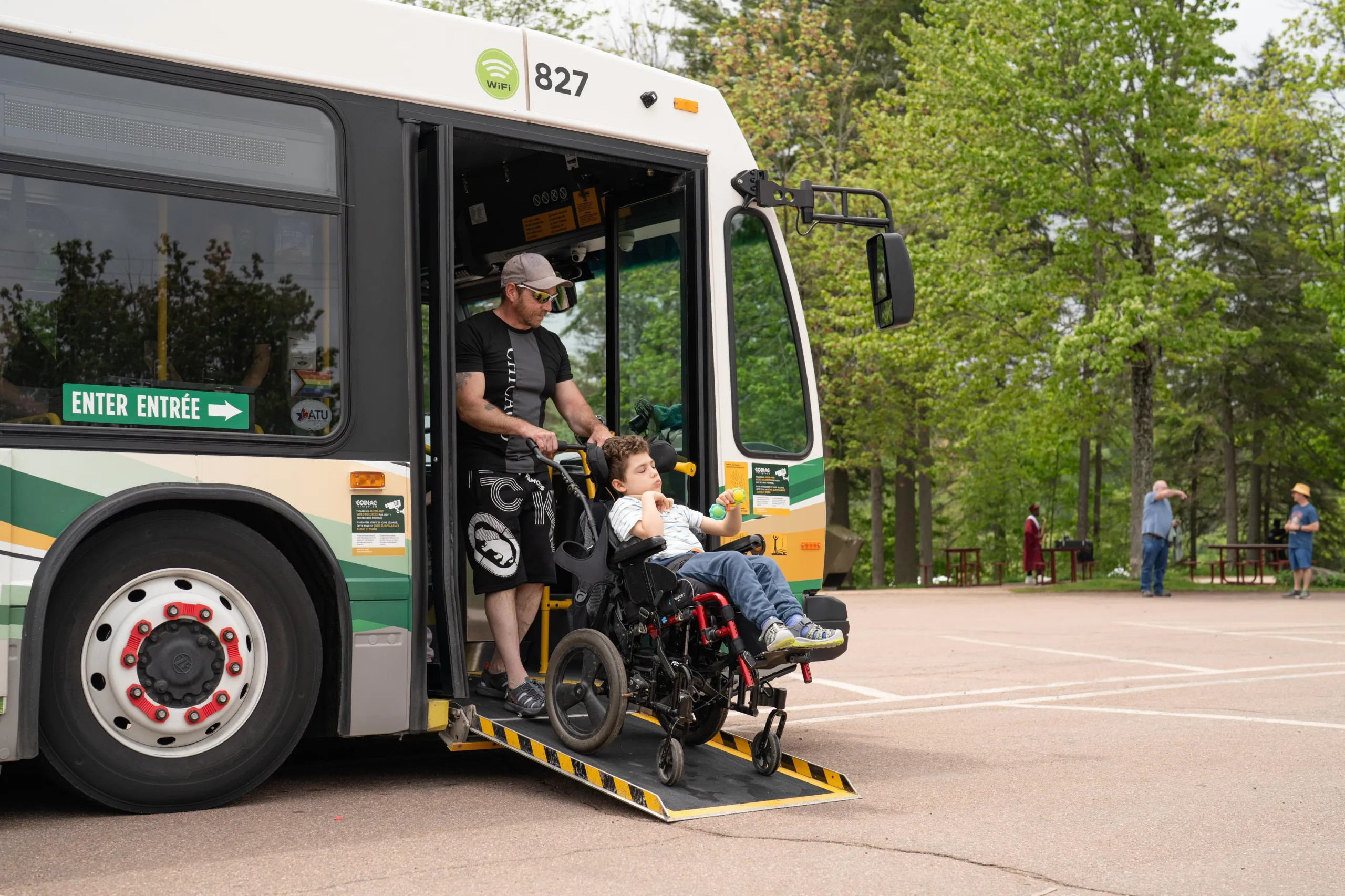 Family getting of the bus at Centennial Park